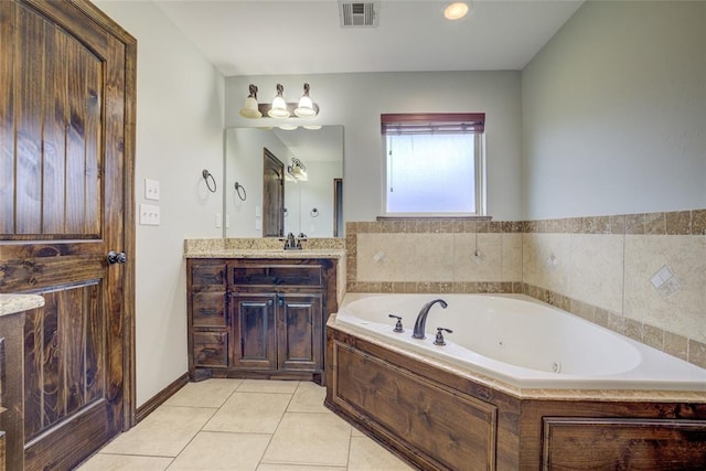 811 W Abi Rd, Washington, OK 73093 - bathroom featuring a jetted tub, vanity, and tile patterned floors