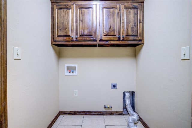 811 W Abi Rd, Washington, OK 73093 - washroom with hookup for an electric dryer, cabinet space, hookup for a gas dryer, hookup for a washing machine, and light tile patterned floors