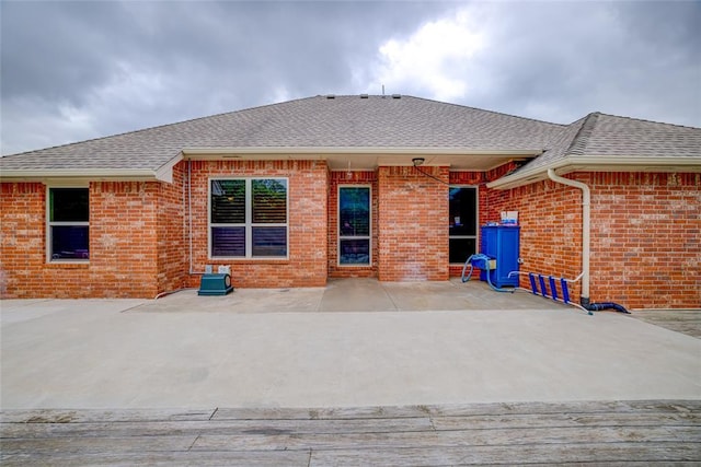 811 W Abi Rd, Washington, OK 73093 - back of property featuring a shingled roof and brick siding