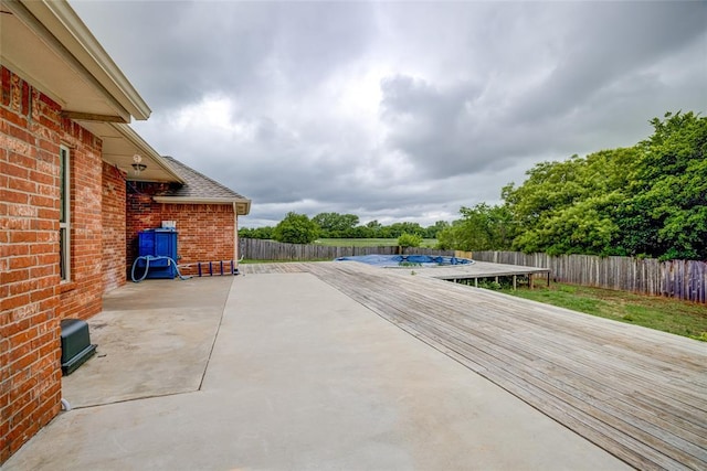 811 W Abi Rd, Washington, OK 73093 - fenced backyard featuring a trampoline, a patio area, and a deck