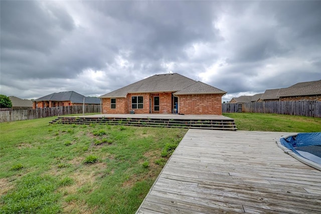 811 W Abi Rd, Washington, OK 73093 - rear view of property with a wooden deck and brick siding