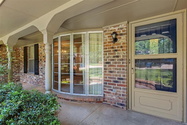 1112 E 11th St, Edmond, OK 73034 - entrance to property with brick siding, covered porch, and french doors