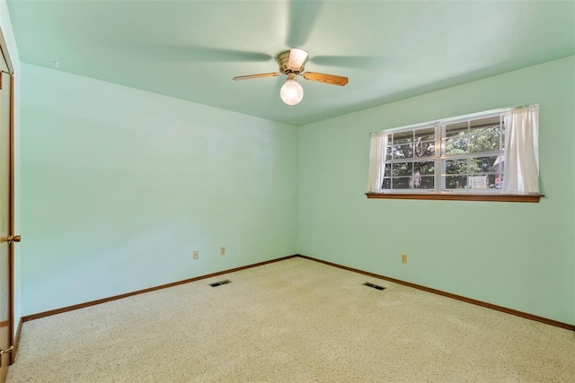 1112 E 11th St, Edmond, OK 73034 - carpeted spare room featuring a ceiling fan and baseboards
