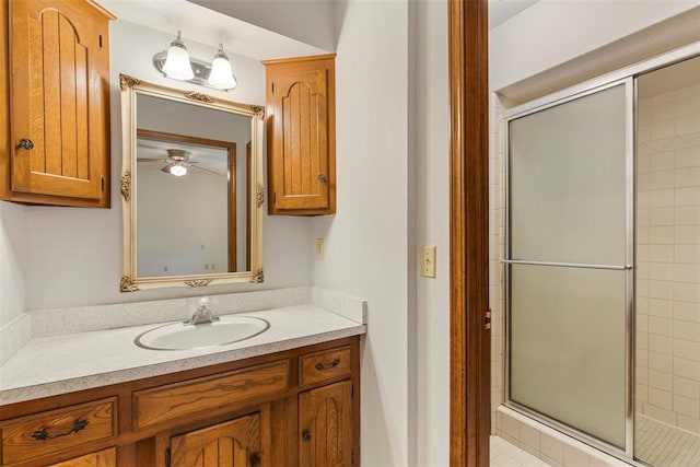 1112 E 11th St, Edmond, OK 73034 - bathroom featuring vanity, a stall shower, and a ceiling fan