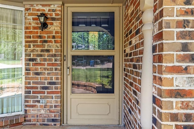 1112 E 11th St, Edmond, OK 73034 - property entrance featuring brick siding