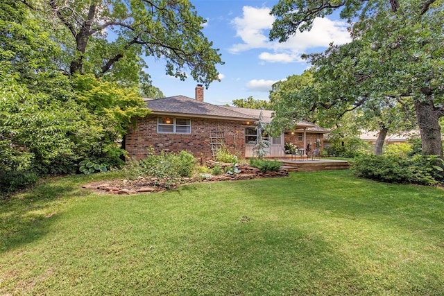 1112 E 11th St, Edmond, OK 73034 - view of grassy yard featuring a wooden deck
