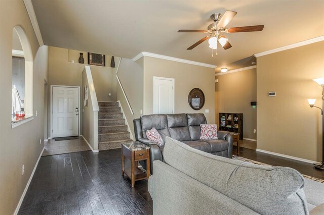 5008 Caleb St, Oklahoma City, OK 73179 - living room featuring ceiling fan, baseboards, dark wood-style floors, stairway, and crown molding