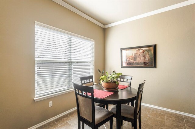 5008 Caleb St, Oklahoma City, OK 73179 - dining area with baseboards, ornamental molding, and tile patterned floors