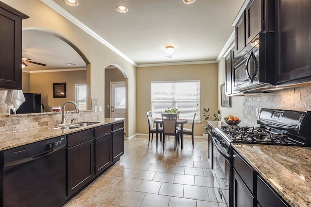 5008 Caleb St, Oklahoma City, OK 73179 - kitchen with black appliances, a sink, tasteful backsplash, plenty of natural light, and crown molding