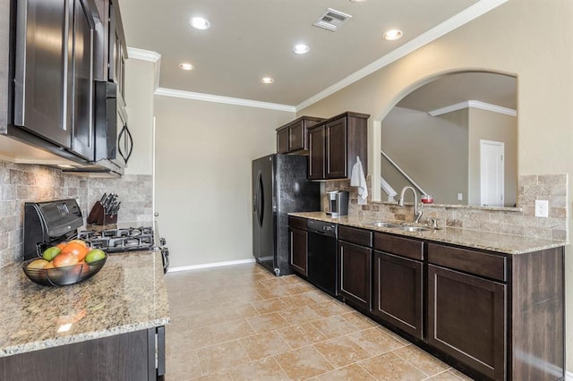 5008 Caleb St, Oklahoma City, OK 73179 - kitchen featuring a sink, black appliances, ornamental molding, arched walkways, and dark brown cabinets