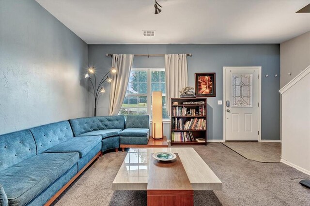 2721 Demotte Dr, Yukon, OK 73099 - carpeted living area featuring baseboards