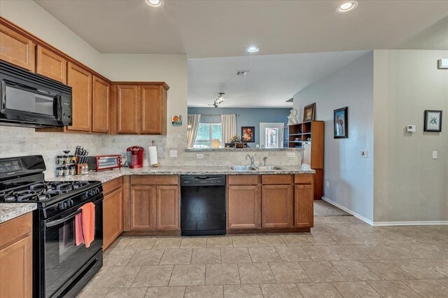 2721 Demotte Dr, Yukon, OK 73099 - kitchen featuring black appliances, a sink, decorative backsplash, brown cabinetry, and recessed lighting