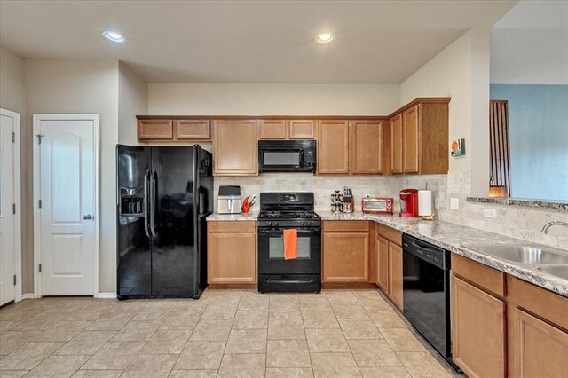 2721 Demotte Dr, Yukon, OK 73099 - kitchen with black appliances, a sink, backsplash, light countertops, and recessed lighting