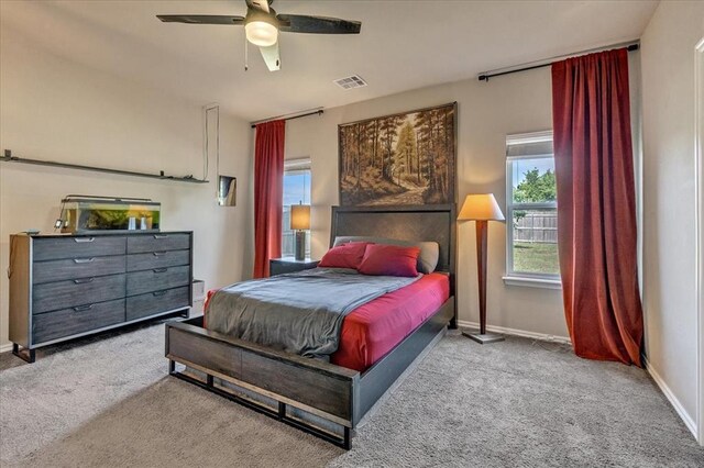 2721 Demotte Dr, Yukon, OK 73099 - carpeted bedroom with baseboards and ceiling fan