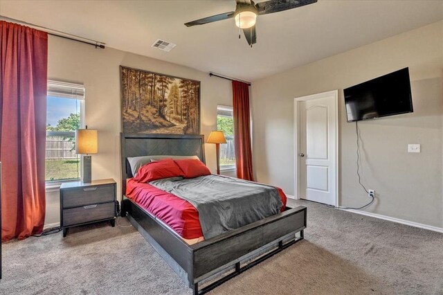 2721 Demotte Dr, Yukon, OK 73099 - bedroom featuring carpet flooring, baseboards, and a ceiling fan