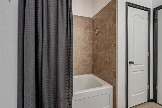 2721 Demotte Dr, Yukon, OK 73099 - bathroom with shower / tub combo with curtain