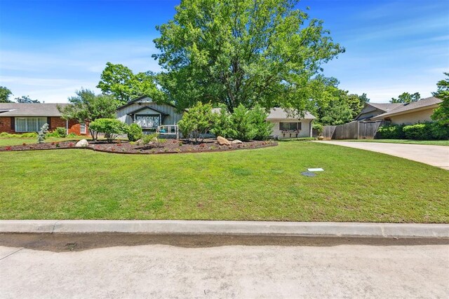 2241 NW 56th St, Oklahoma City, OK 73112 - view of front of home featuring concrete driveway and brick siding