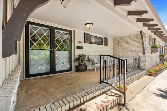 2241 NW 56th St, Oklahoma City, OK 73112 - doorway to property with a porch and french doors