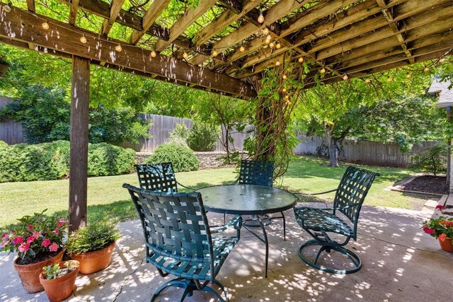 2241 NW 56th St, Oklahoma City, OK 73112 - view of patio featuring outdoor dining area and a pergola