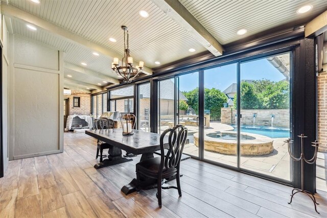 1324 NW 157th St, Edmond, OK 73013 - sunroom / solarium featuring a chandelier, beam ceiling, a hot tub, and french doors