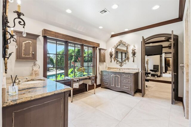 1324 NW 157th St, Edmond, OK 73013 - full bath featuring two vanities, vaulted ceiling, recessed lighting, ornamental molding, and tile patterned flooring