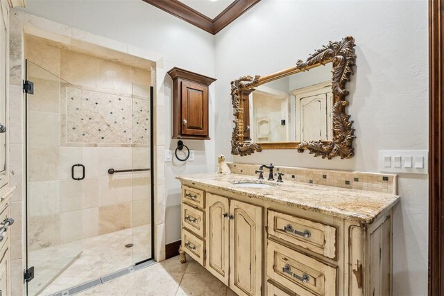 1324 NW 157th St, Edmond, OK 73013 - bathroom with vanity, a shower stall, decorative backsplash, tile patterned floors, and crown molding