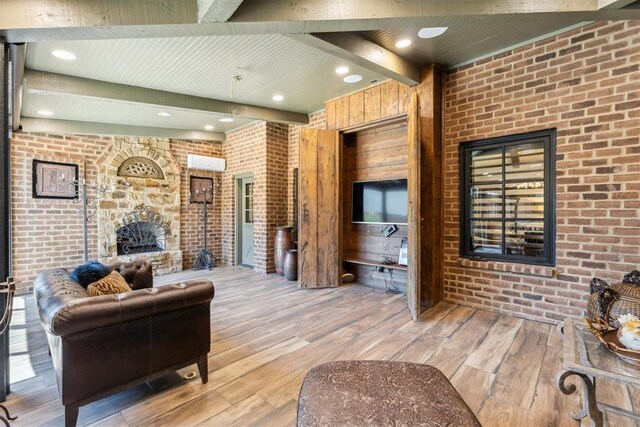 1324 NW 157th St, Edmond, OK 73013 - living room with a fireplace, brick wall, beamed ceiling, light wood finished floors, and recessed lighting