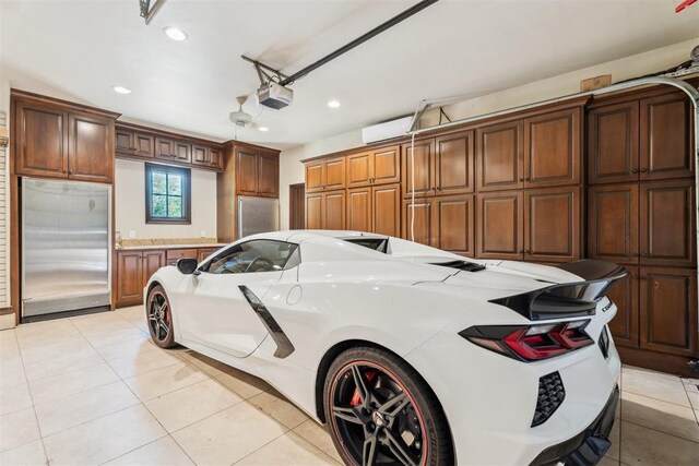 1324 NW 157th St, Edmond, OK 73013 - garage with stainless steel built in refrigerator, recessed lighting, and a garage door opener