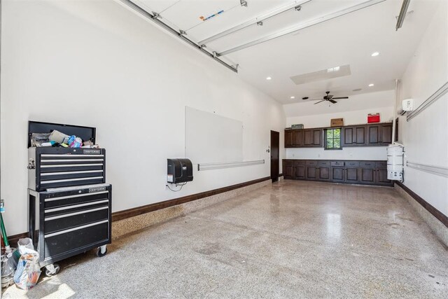 1324 NW 157th St, Edmond, OK 73013 - garage featuring baseboards, recessed lighting, and a ceiling fan