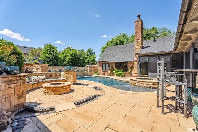 1324 NW 157th St, Edmond, OK 73013 - view of pool featuring an outdoor fire pit, a patio, and a pool with connected hot tub