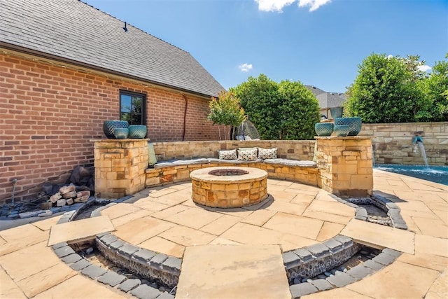 1324 NW 157th St, Edmond, OK 73013 - view of patio / terrace with a fire pit