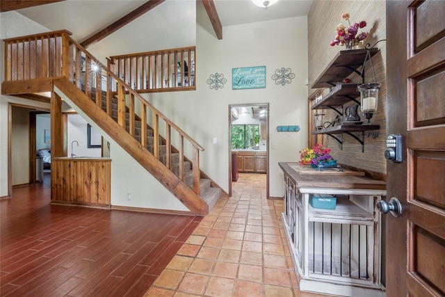 13220 Shady Tree Pl, Edmond, OK 73013 - foyer entrance featuring stairway, baseboards, a high ceiling, beam ceiling, and wood finished floors