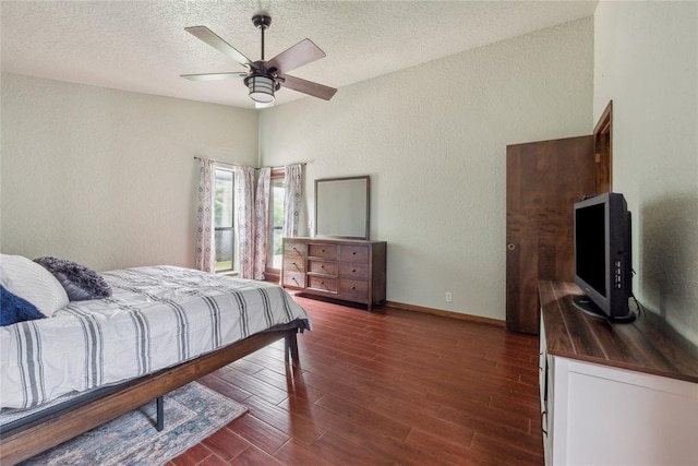 13220 Shady Tree Pl, Edmond, OK 73013 - bedroom with a textured wall, wood finished floors, baseboards, a textured ceiling, and a ceiling fan