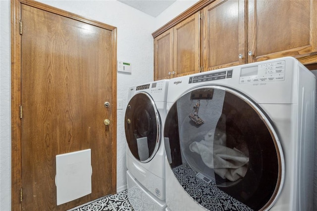 13220 Shady Tree Pl, Edmond, OK 73013 - laundry room with cabinet space and washing machine and dryer