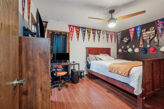 13220 Shady Tree Pl, Edmond, OK 73013 - bedroom with wood finished floors and a ceiling fan