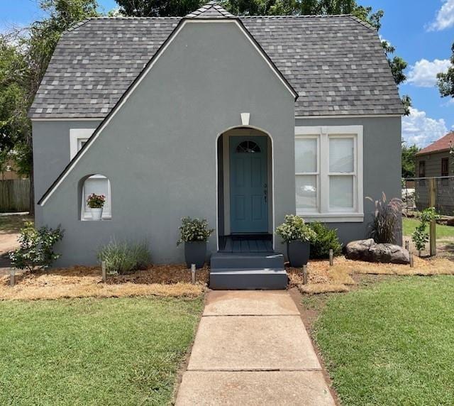 306 E Hughbert St, Norman, OK 73069 - view of front facade with a shingled roof and stucco siding