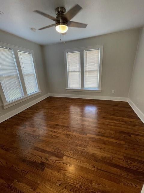 306 E Hughbert St, Norman, OK 73069 - empty room with baseboards, dark wood finished floors, and ceiling fan