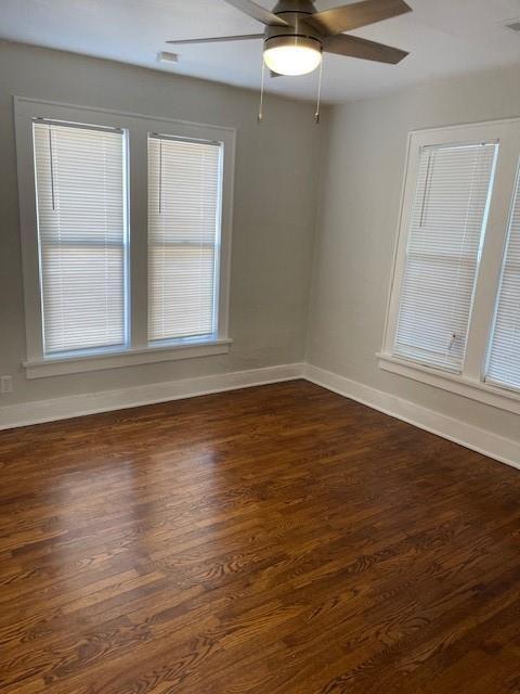 306 E Hughbert St, Norman, OK 73069 - empty room with baseboards, dark wood-style flooring, and ceiling fan
