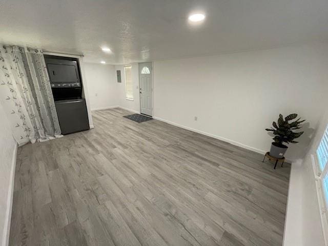 306 E Hughbert St, Norman, OK 73069 - unfurnished living room featuring wood finished floors and baseboards