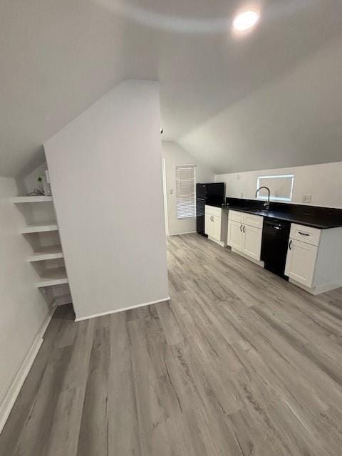 306 E Hughbert St, Norman, OK 73069 - additional living space featuring vaulted ceiling, a sink, light wood-style flooring, and baseboards