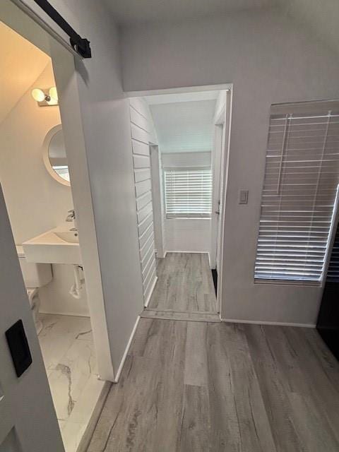 306 E Hughbert St, Norman, OK 73069 - corridor featuring baseboards and a sink