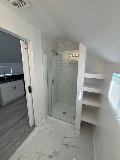 306 E Hughbert St, Norman, OK 73069 - full bath with a shower stall, vanity, marble finish floors, and baseboards