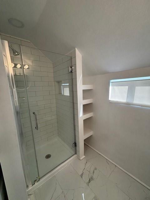 306 E Hughbert St, Norman, OK 73069 - full bathroom with a stall shower, marble look tiles, and baseboards