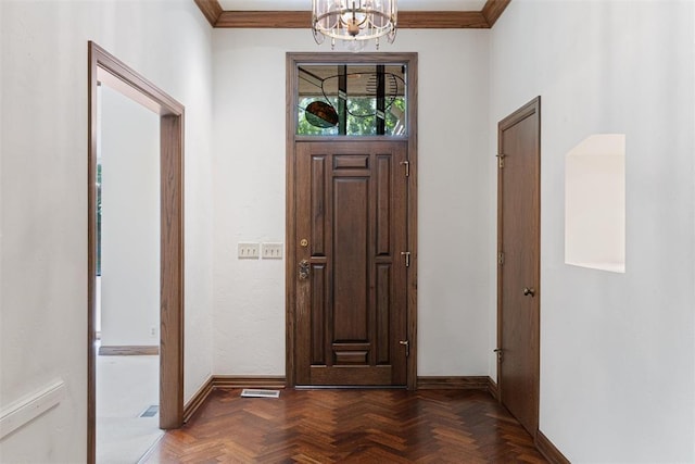 1409 Glenbrook Ter, Nichols Hills, OK 73116 - entrance foyer with a chandelier, baseboards, and crown molding
