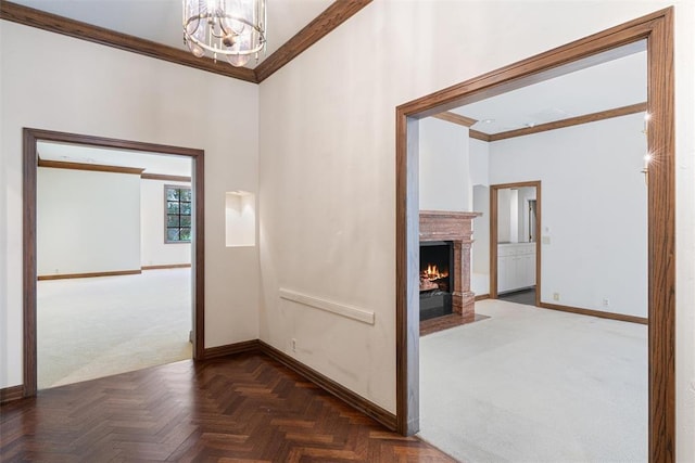 1409 Glenbrook Ter, Nichols Hills, OK 73116 - corridor with baseboards, ornamental molding, a chandelier, and carpet flooring