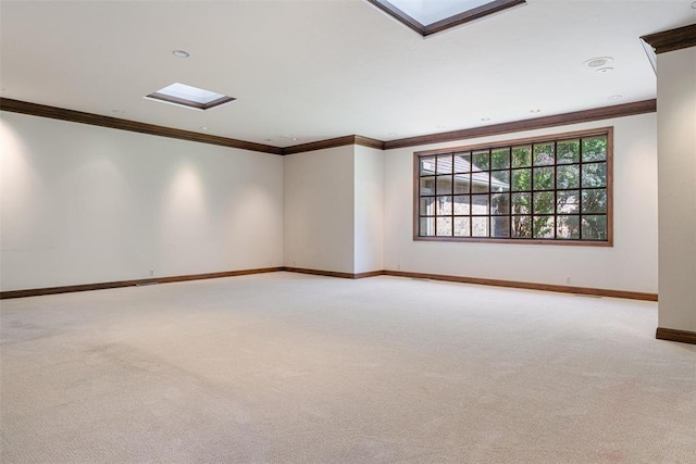 1409 Glenbrook Ter, Nichols Hills, OK 73116 - spare room featuring a skylight, light colored carpet, ornamental molding, and baseboards