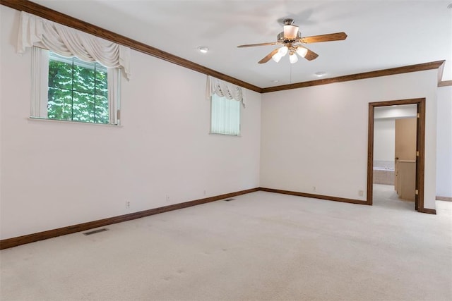 1409 Glenbrook Ter, Nichols Hills, OK 73116 - empty room featuring light carpet, baseboards, crown molding, and a ceiling fan