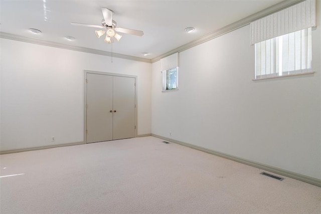 1409 Glenbrook Ter, Nichols Hills, OK 73116 - carpeted empty room with crown molding, ceiling fan, healthy amount of natural light, and baseboards