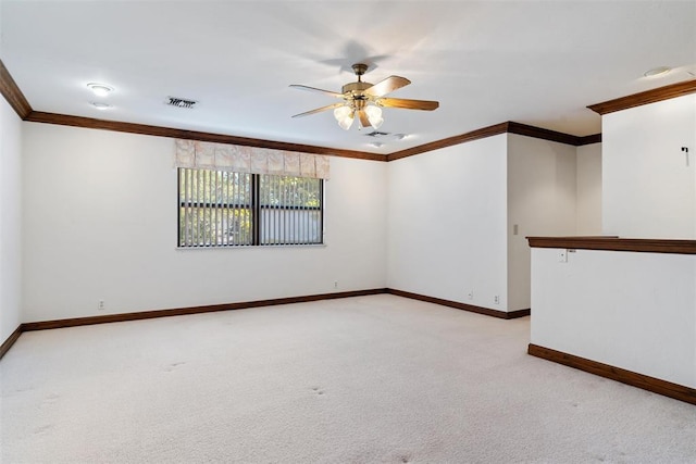 1409 Glenbrook Ter, Nichols Hills, OK 73116 - unfurnished room featuring crown molding, a ceiling fan, baseboards, and light carpet