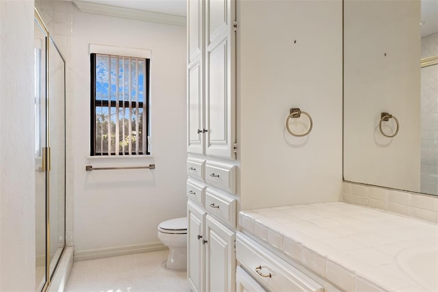 1409 Glenbrook Ter, Nichols Hills, OK 73116 - full bath with toilet, vanity, a shower stall, ornamental molding, and baseboards